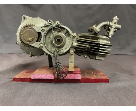 A Vincent Firefly enginenumbered TO5AB-1 50786 mounted on a wooden stand, with Amal carburettor attached, condition and compl