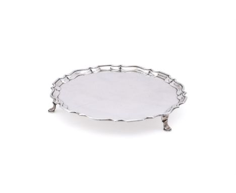
	
		A SILVER SHAPED CIRCULAR SALVER
		HAWKSWORTH, EYRE &amp; CO. LTD., SHEFFIELD 1924
		With a raised moulded border and on 