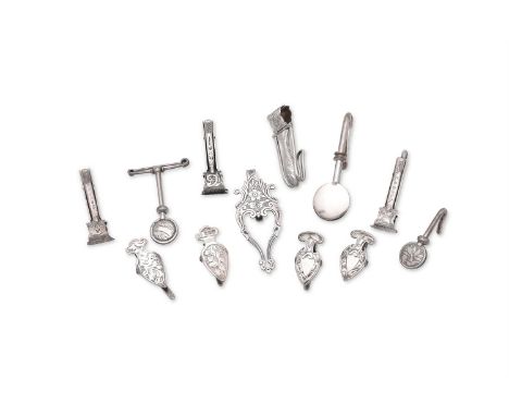 
	
		TWELVE SILVER NAPKIN CLIPS
		VARIOUS MAKER'S AND DATES
		To include: a Victorian fish napkin clip by Rolason Brothers, B