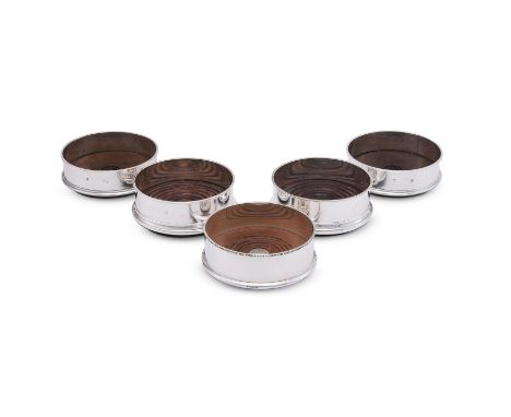 
	
		FIVE MODERN SILVER MOUNTED WINE COASTERS
		To include: a pair of silver mounted wine coasters by Argyll Silver, Birmingh