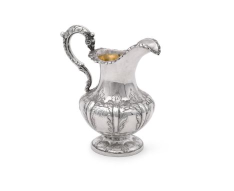 
	
		A VICTORIAN SILVER BALUSTER CREAM JUG
		SAMUEL HAYNE &amp; DUDLEY CARTER, LONDON 1865
		With a chased floral border, a l