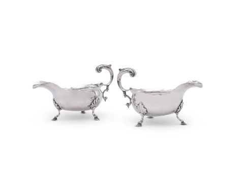 
	
		A PAIR OF GEORGE II SILVER SHAPED OVAL SAUCE BOATS
		THOMAS WALLIS I, LONDON 1754
		With lead capped flying scroll handl