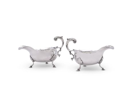 
	
		A PAIR OF GEORGE II SILVER SHAPED OVAL SAUCE BOATS
		THOMAS WALLIS I, LONDON 1754
		With lead capped flying scroll handl