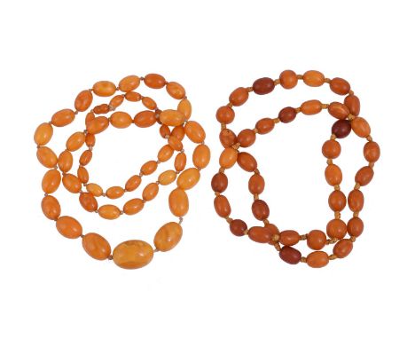 
	
		TWO BUTTERSCOTCH AMBER BEAD NECKLACES
		The first with graduated oval beads on a knotted strand; the second with oval an