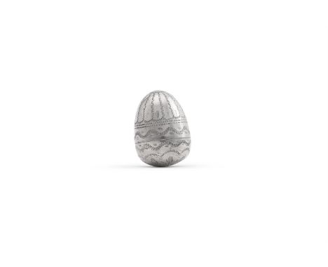A SILVER COLOURED ACORN SHAPED NUTMEG GRATER UNMARKED Engraved with decorative bands, opening to a steel grater 3cm (1 1/4in)