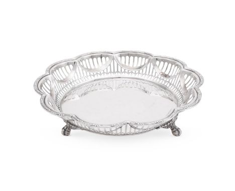 
	
		A SILVER SHAPED CIRCULAR FRUIT DISH
		WALKER AND HALL, SHEFFIELD 1911
		With a reeded and foliate border, pierced body a