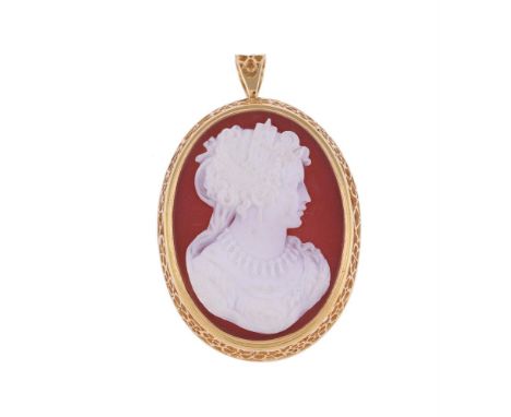 
	
		A HARDSTONE CAMEO BROOCH/PENDANT 
		LONDON 1975 
		The oval panel carved with the profile of a lady in classical dress, 