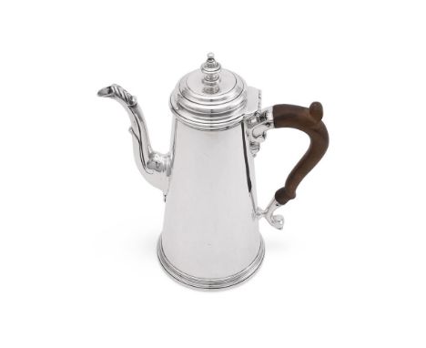 
	
		A SILVER TAPERING COFFEE POT
		WILLIAM COMYNS &amp; SONS LTD., LONDON 1929 
		With a bell shaped finial to the ogee dome