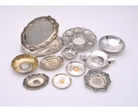 
	
		TWELVE CONTINENTAL SILVER COLOURED DISHES
		To include: a German silver coloured shaped oval dish, post 1886 .800 standa