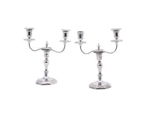 
	
		A MATCHED PAIR OF EDWARDIAN SILVER TWO BRANCH CANDELABRA
		HAWKSWORTH, EYRE &amp; CO. LTD., SHEFFIELD 1906 AND 1908
		Oc