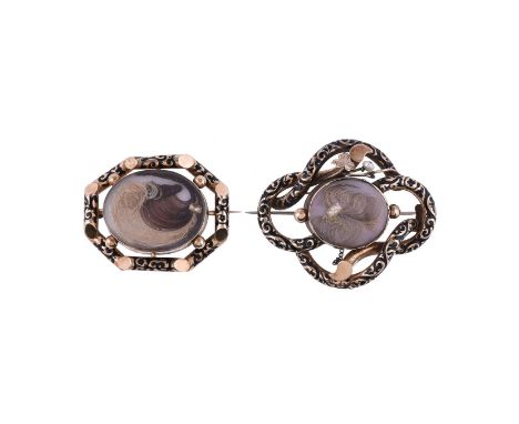 
	
		TWO EARLY VICTORIAN MOURNING BROOCHES
		The first with an oval panel with a scroll of hair and pearl accented detail, wi