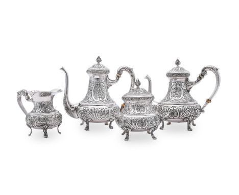 
	
		Y&nbsp;AN EGYPTIAN SILVER COLOURED FOUR PIECE TEA SET
		POST 1946
		The tea and hot water pots with cone finials to the 