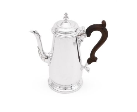 
	
		A SILVER COFFEE POT 
		HANCOCKS &amp; CO., LONDON 1966
		With a turned finial to the domed cover, a wood scroll handle a