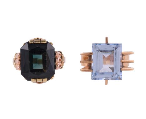 
	
		TWO 1940S DRESS RINGS
		The first with a step cut blue synthetic spinel, within a radiating geometric gold coloured sett