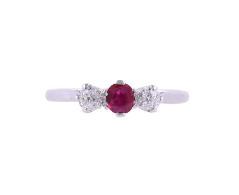 
	
		A RUBY AND DIAMOND THREE STONE RING
		The oval cut ruby between two old brilliant cut diamonds, approximately 0.20 carat