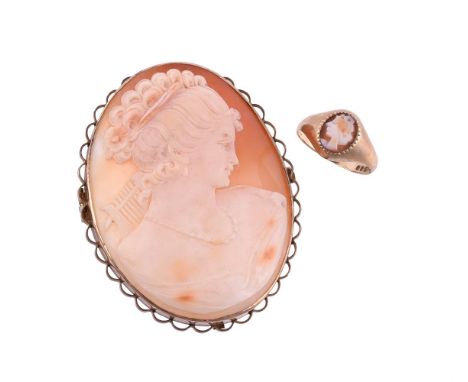 
	
		A 1960S SHELL CAMEO BROOCH
		The oval shell cameo carved with the profile of a lady wearing a beaded necklace, her curle