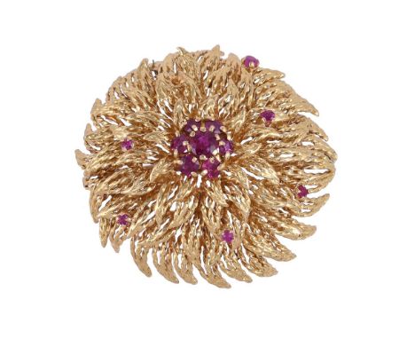 
	
		A RUBY FLOWER HEAD CLUSTER BROOCH
		The flower head with numerous rope twist wire petals, with ruby accents and a centra