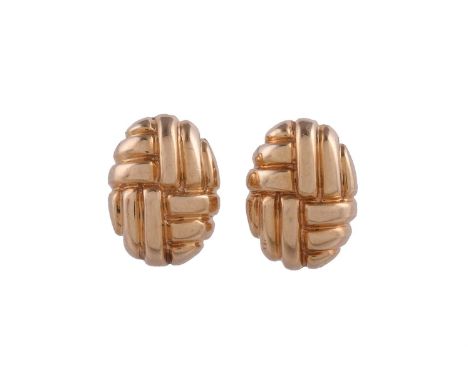
	
		A PAIR OF OVAL PANEL EAR CLIPS
		The oval panels with woven style decoration, stamped 14k
		Size/dimensions: 2.1cm long
