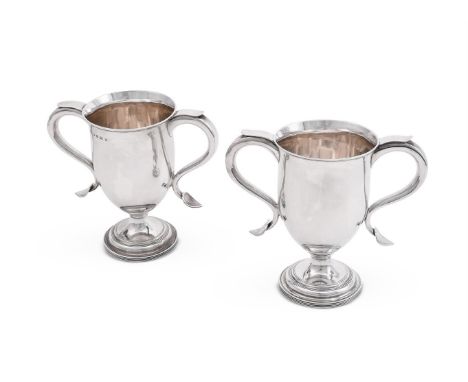 
	
		A PAIR OF VICTORIAN SILVER TWIN HANDLED CUPS
		HAWKSWORTH, EYRE &amp; CO., SHEFFIELD 1855 
		With twin scroll handles an
