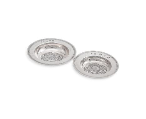 
	
		TWO SILVER ARMADA DISHES
		C. J. VANDER LTD., LONDON 1952 AND 1953
		With a reeded border and chased with a Tudor rose
	