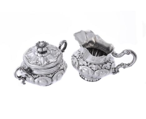 
	
		A silver cream jug and sugar basin and cover, 13 1/2 lodigit, Scandinavian, 19th century, Dutch import tax marks, lobed 