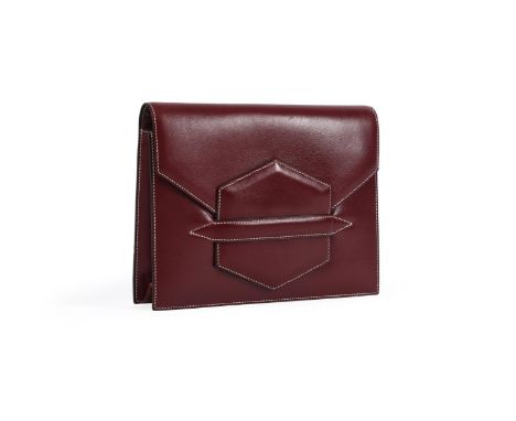 
	
		HERMES, FACO
		A RED LEATHER CLUTCH BAG, CIRCA 1979
		With a flap fastener opening to a red leather four compartment int