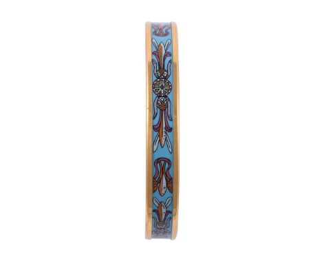
	
		HERMÉS, AN ENAMELLED BANGLE
		The decorative turquoise band with pink, white and orange designs, with gilt metal setting
