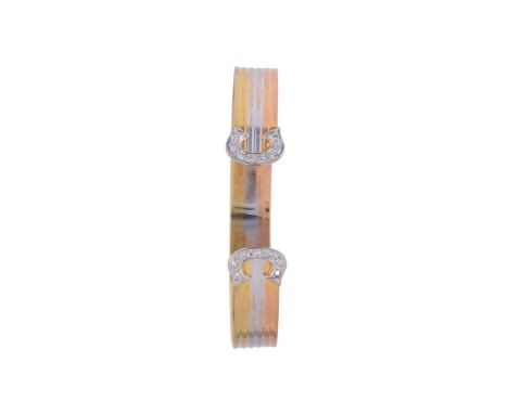 
	
		A THREE COLOUR DIAMOND BANGLE
		The three colour reeded bangle to eight cut diamond accented C shaped terminals, approxi