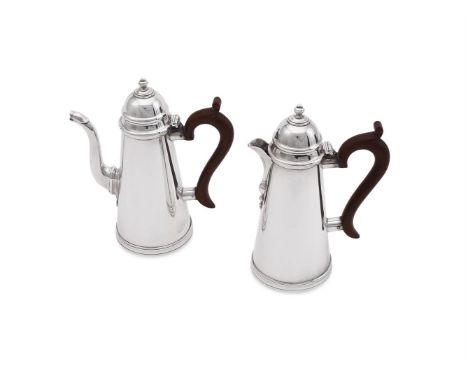 
	
		A PAIR OF SILVER TAPERING CAFE AU LAIT POTS
		S. W. SMITH &amp; CO., BIRMINGHAM 1927
		With knopped orb finials to the d