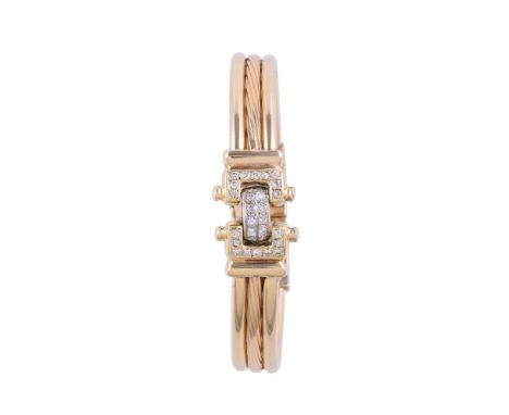 
	
		A DIAMOND HINGED BANGLE 
		The articulated front panel set with brilliant cut diamonds, approximately 0.65 carats total,