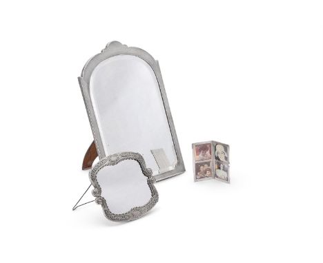 
	
		A SILVER MOUNTED PHOTO FRAME
		SANDERS &amp; MACKENZIE, BIRMINGHAM 1925
		With an engine turned border
		35cm (13 3/4in)