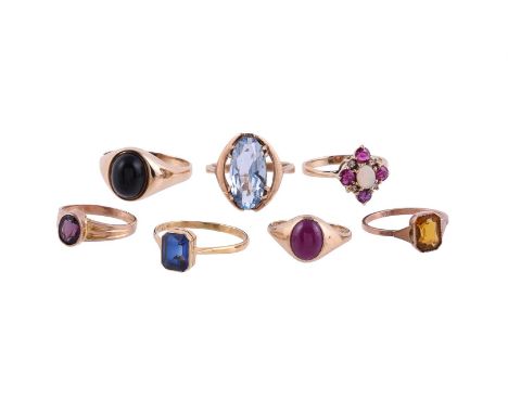 
	
		A COLLECTION OF GEM SET RINGS
		To include a synthetic sapphire single stone ring, the step cut synthetic sapphire with 