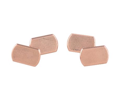 
	
		A PAIR OF 9 CARAT GOLD CUFFLINKS 
		BIRMINGHAM 1927
		The rectangular panels with rounded ends, engine turned decoration