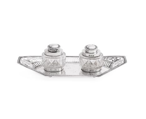 AN EDWARDIAN SILVER INKSTAND WILLIAM HUTTON &amp; SONS LTD., LONDON 1904  With a cable twist border, pierced with foliate swa