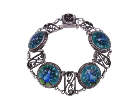 
	
		AN ARTS AND CRAFTS ENAMELLED PEACOCK BRACELET 
		CIRCA 1900
		The four roundels with blue and green enamelled peacocks d