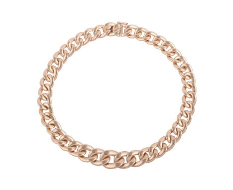 
	
		A FLATTENED CURB LINK NECKLACE
		The graduated polished flattened curb links to a concealed clasp, stamped Italy 14kt
		