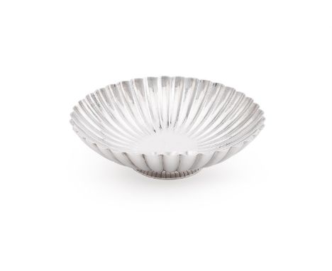
	
		A BRITANNIA STANDARD SHAPED CIRCULAR DISH
		WILLIAM WALTER ANTIQUES LTD., LONDON 1969 
		With a fluted body and on a cir