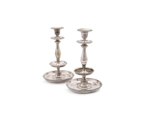 
	
		A PAIR OF FRENCH ELECTRO-PLATED CANDLESTICKS
		CHRISTOFLE, EARLY 20TH CENTURY
		With beaded borders to the sconces, drip