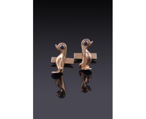 
	
		HANS GEORGE MAUTNER, A PAIR OF 9 CARAT GOLD SAPPHIRE SET PENGUIN CUFFLINKS 
		LONDON 1963
		The stylised penguins with c