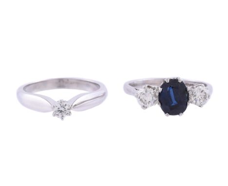 
	
		A SAPPHIRE AND DIAMOND THREE STONE RING
		The oval cut sapphire flanked by two brilliant cut diamonds, approximately 0.5