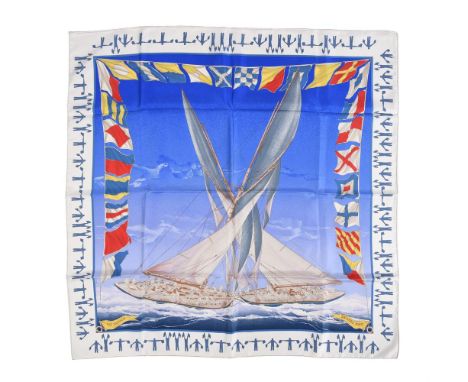 
	
		HERMÈS, EN COURSE, A SILK SCARF
		With graded bright blue ground and white border, rolled hand stitched edges, with Herm