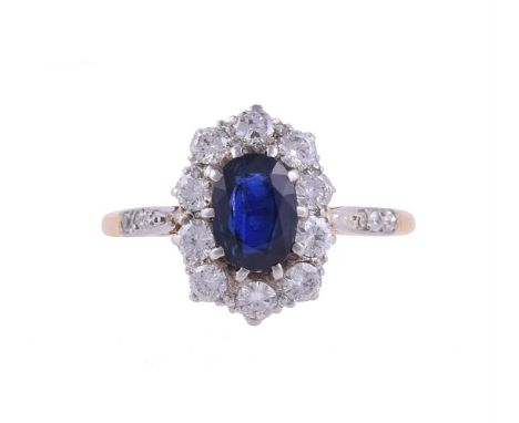 
	
		A SAPPHIRE AND DIAMOND CLUSTER RING
		The oval cut sapphire within a surround of brilliant cut diamonds, to diamond acce