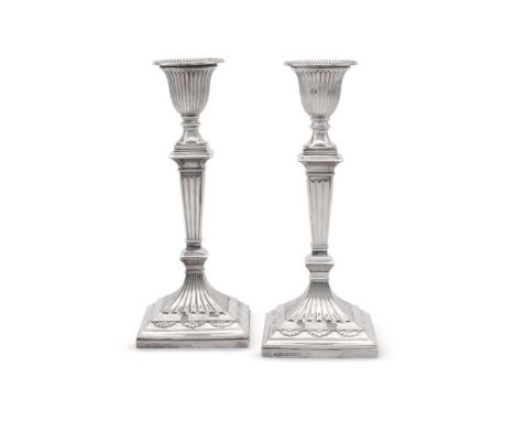 
	
		A PAIR OF VICTORIAN SILVER CANDLESTICKS
		JOHN KIRSTEN BAILY, SHEFFIELD 1889
		With beaded sconces, fluted capitals, tap
