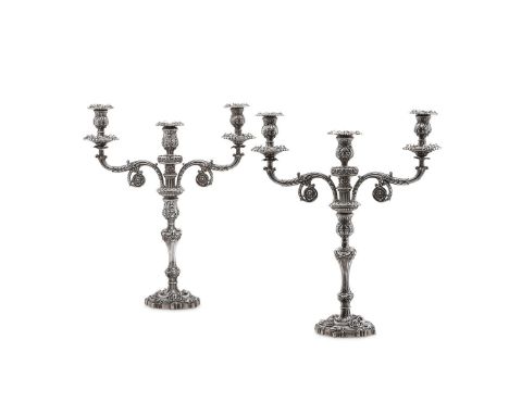 
	
		A PAIR OF GEORGE IV SILVER THREE LIGHT CANDELABRA
		S. C. YOUNGE &amp; CO., SHEFFIELD 1821
		With leaf fluted sconces en