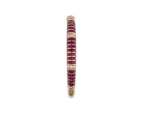 
	
		A RUBY AND DIAMOND HINGED BANGLE
		The bangle with channel set rows of step cut rubies with brilliant cut diamond spacer