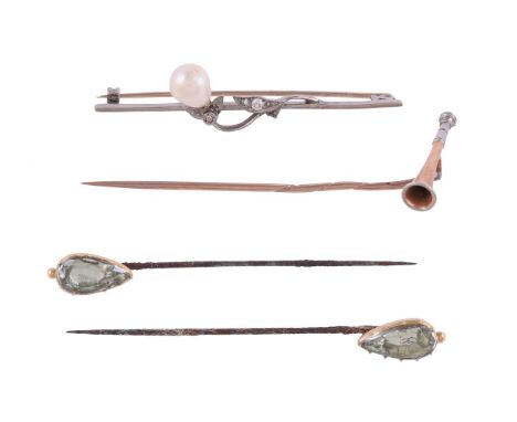 
	
		A SMALL COLLECTION OF STICK PINS AND A BAR BROOCH
		The first with a two colour hunting horn shaped terminal, early 20th