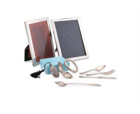 
	
		A COLLECTION OF AMERICAN SILVER COLOURED ITEMS
		To include: a silver coloured mounted photo frame by Tiffany &amp; Co.,