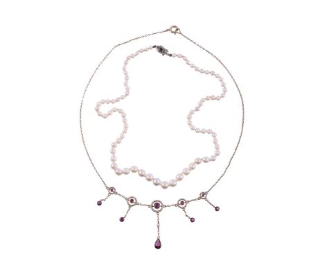 
	
		AN EARLY 20TH CENTURY SILVER GILT GARNET NECKLACE 
		CIRCA 1910
		The front with graduated pierced white enamelled circu