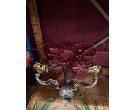 Art deco two-light wall appliqué, with cranberry glass shadesBoth shades in good order, 8.1cm diameter at bases, 23.5cm high,