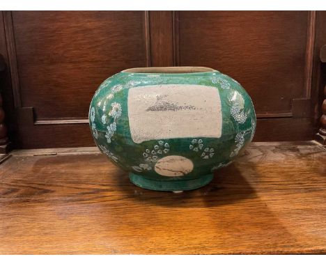 Unusual Chinese stoneware planter, probably early 20th century, of oblong form, painted with grisaille panels on a green flor